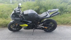 Yamaha R1 2008 rental Thailand left side view on road with green background