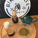 Perparation for live pouring of an Iced Espresso Matcha Latte