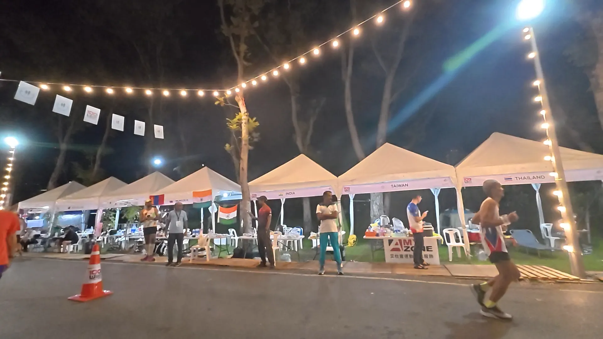 Runners supply tents for international ultra teams at Ultra Park Run Thailand 100
